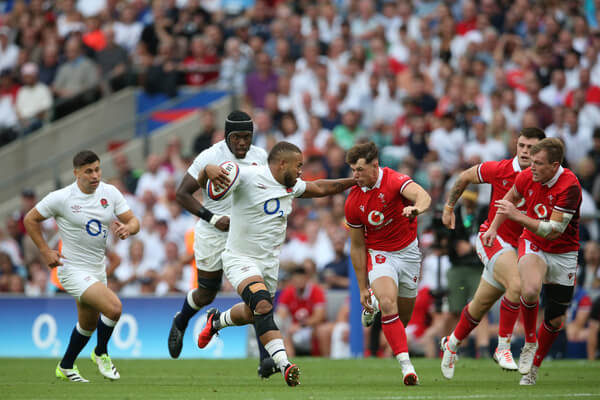 Ollie Lawrence takes on the Welsh defence during the 2023 Summer Series match at Twickenham