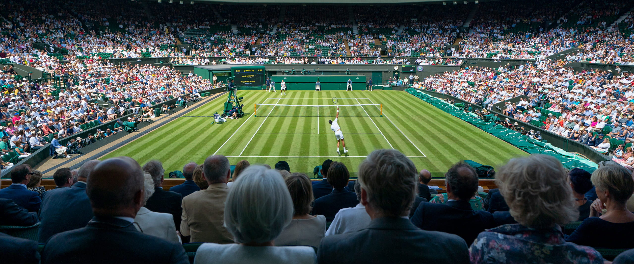 View from seat from Centre Court watching Novak Djokovic serve