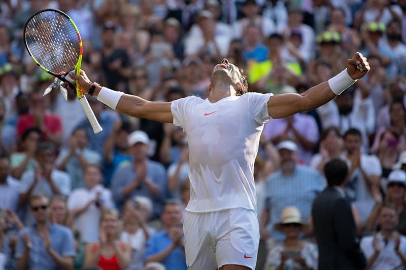 Rafael Nadal celebrating a win at The Championships Wimbledon on Centre Court
