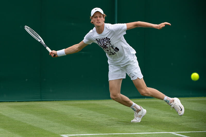 tennis player Jannick Sinner playing in a match at Wimbledon