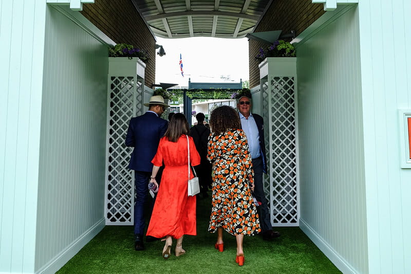 Guest in Rosewater Pavilion making their way to the tennis on Centre Court at Wimbledon