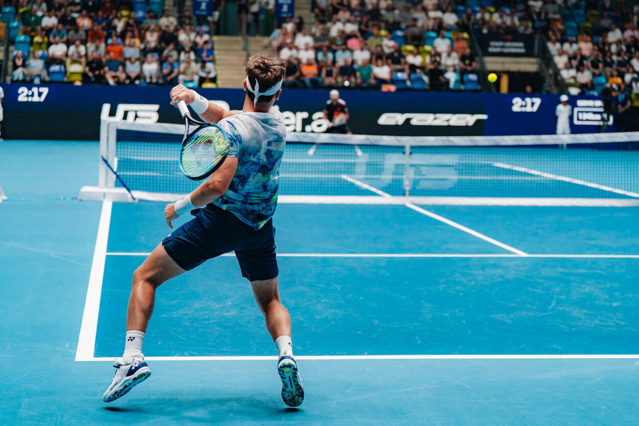 Tennis player Casper Ruud hitting a tennis ball on court at the Frankfurt UTS tournament