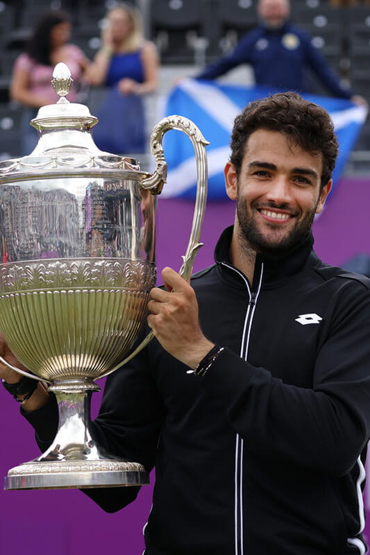 Matteo Berrettini holding the cinch championship trophy at 2021 Queen's Club 