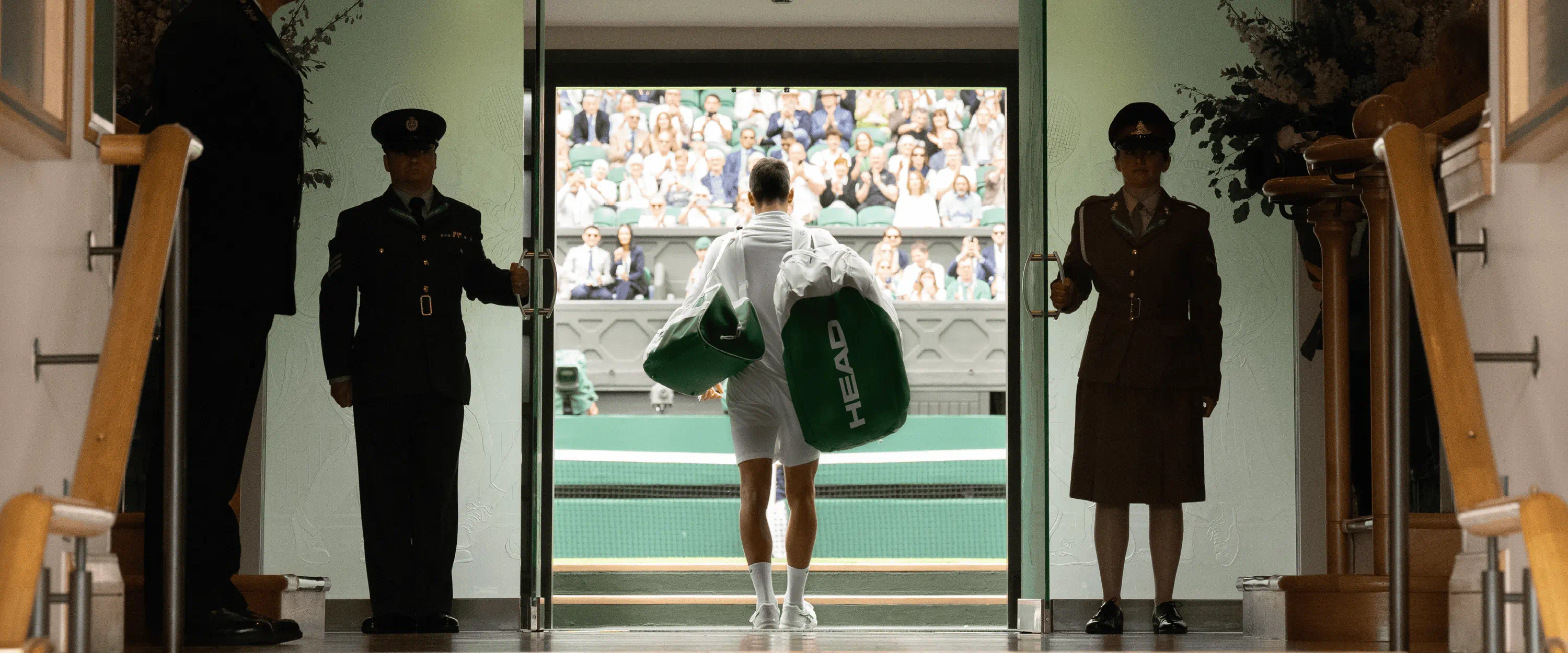 Tennis player Novak Djokovic walking out onto Centre Court at The Championships, Wimbledon