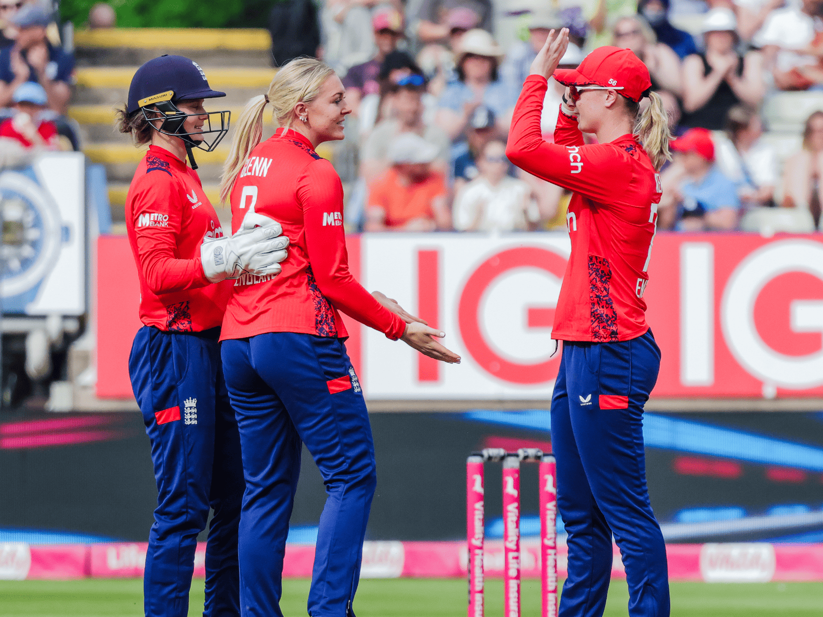 England women's T20 cricket team during a match high fiving