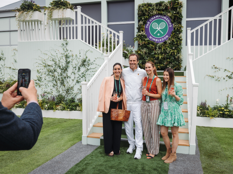Hospitality guests at Wimbledon taking a photo outside
