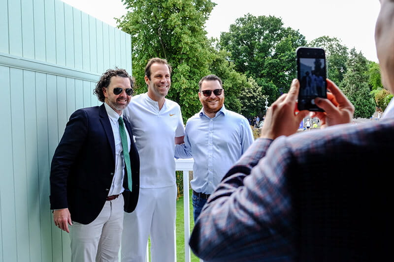 Former British tennis player Greg Rusedski outside Rosewater Pavilion with guests taking photos
