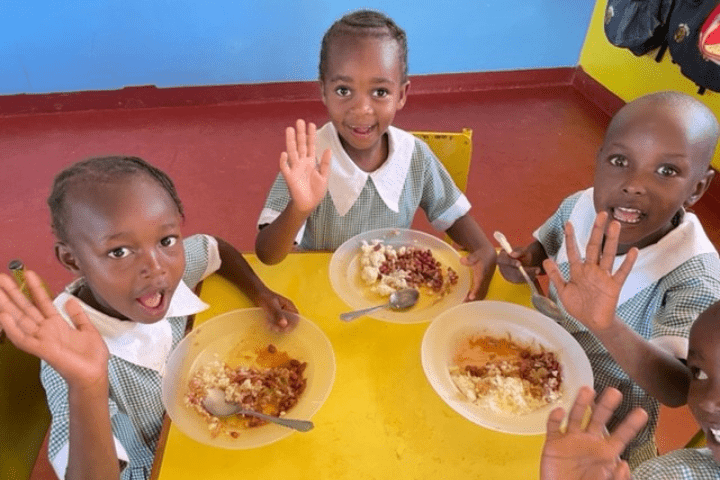 Children enjoying a hot meal supplied by Keith Prowse.