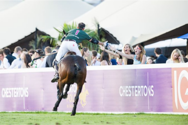 Polo player greeting fans