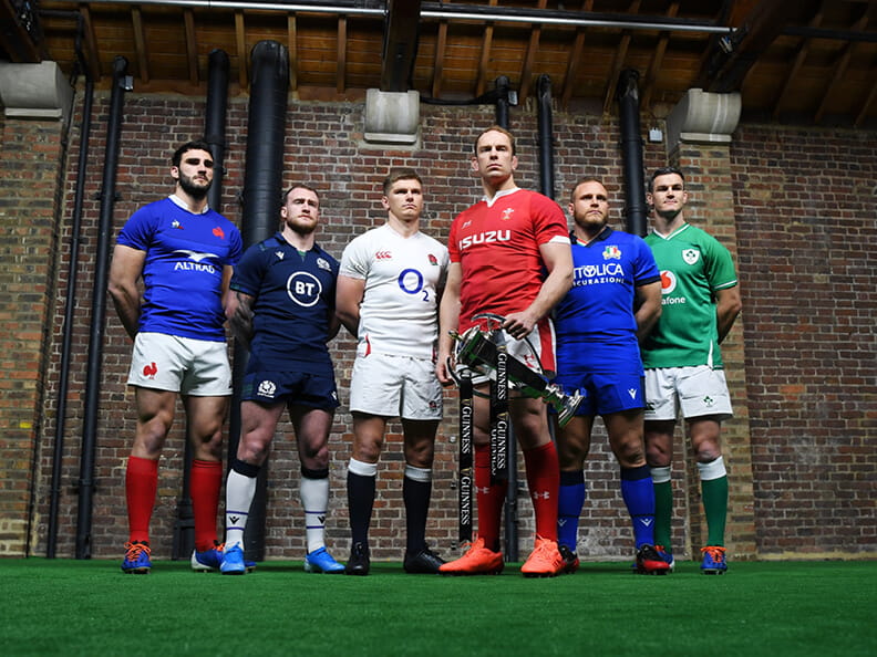 Six Nations Team Captains standing together with Welsh Captain Alun Wyn Jones holding teh trophy.