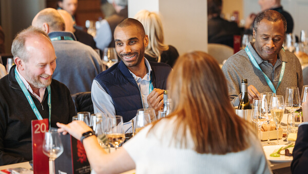 Guests networking in The East Wing over dinner