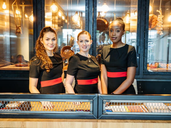 Service staff at the welcome desk in The Gate