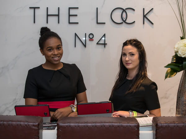 Service staff at the welcome desk in The Lock