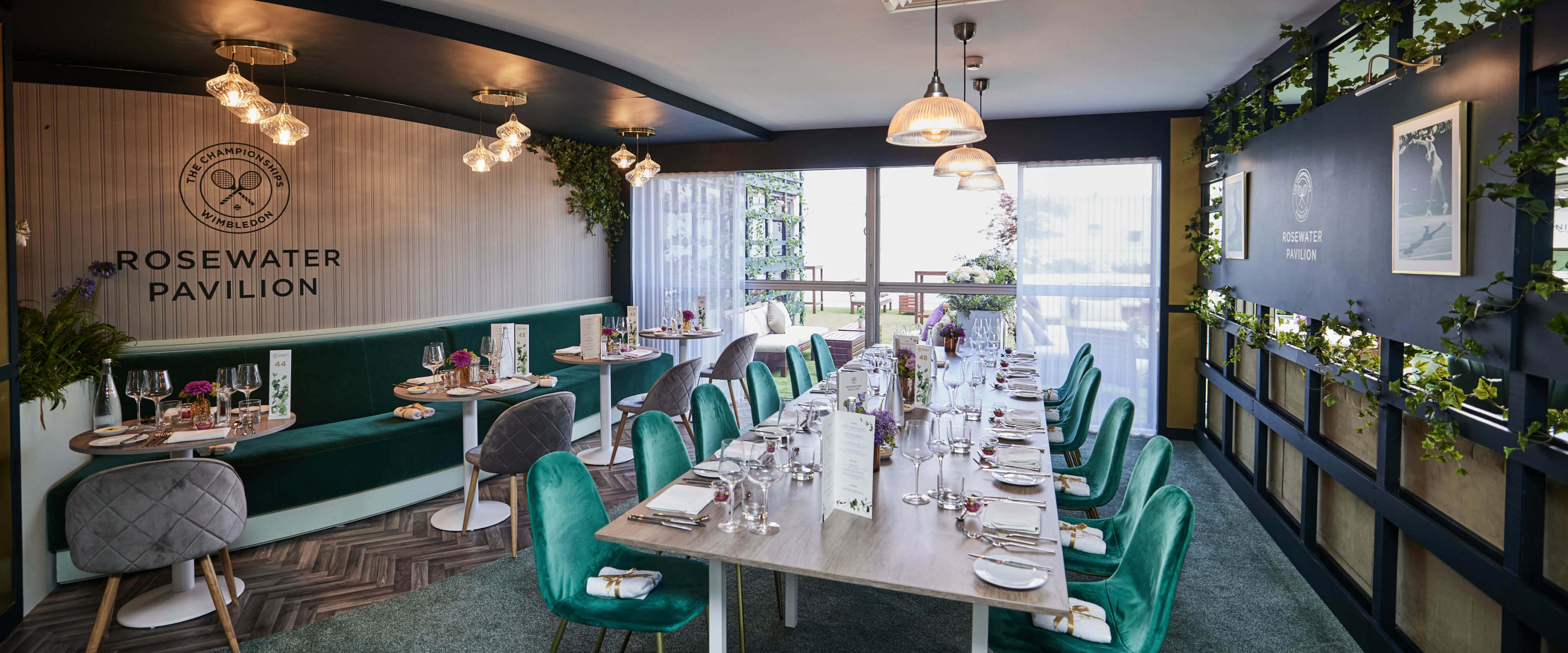 Rosewater Pavilion hospitality facility seating area with tables set for guest arrival at The Championships Wimbledon