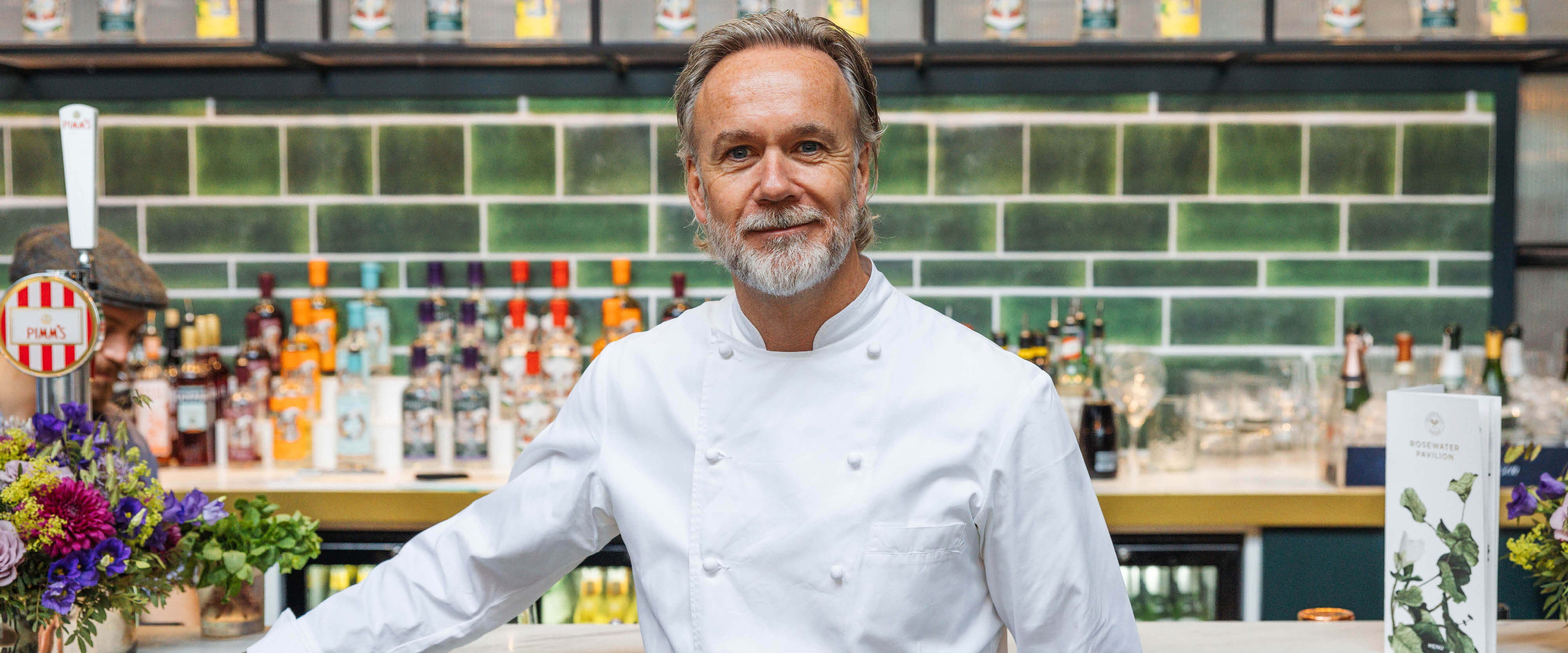 Michelin Star chef Marcus Wareing inside the Rosewater Pavilion hospitality facility at The Championships Wimbledon cooking for guests with Keith Prowse